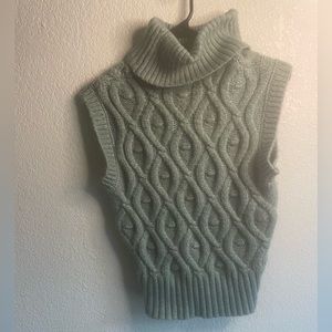 Green sleeveless turtleneck sweater
